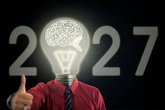 New Year 2027 Innovation Concept with Businessman Giving Thumbs Up and Light Bulb Brain Head