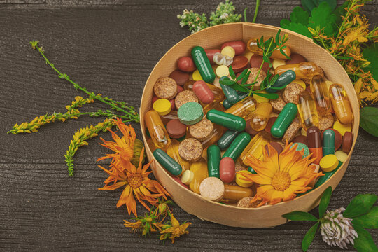 Plant based supplements, natural vitamins, fresh herbs and flowers. Organic ingredients medication