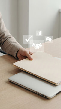 Business multitasking workflow with hand, document, and digital agreement icons on desk