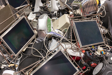 Naklejka na ściany i meble Pile Of Discarded Electronic Waste Including Monitors Keyboards And Other Devices For Recycling Or Environmental Concepts
