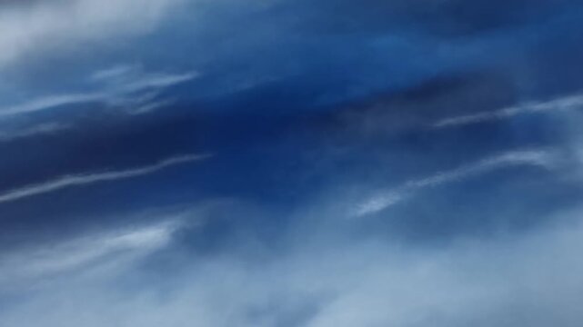 Towering Clouds Drift Across a Deep Blue Sky in a Dramatic Atmospheric Sequence
