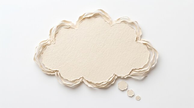 Cream colored paper thought cloud cutout with rough torn edges on a clean white background for creative design projects and speech bubble ideas