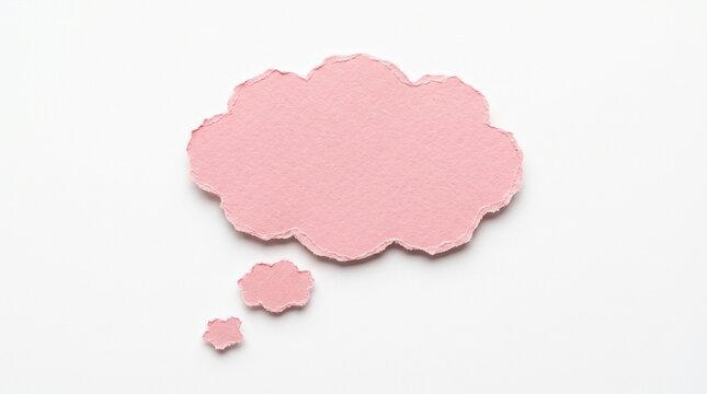 A pink thought bubble cut out of textured paper isolated on white background with torn edges representing ideas and communication concepts now.