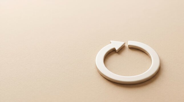 Arrow loop symbol rests on a neutral beige background to represent the concept of continuous recycling or repetition.