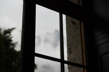 Obraz premium view from window mountain panorama with rural houses window of room