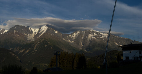 Obraz premium Summer view of the Mont Blanc massif above forested slopes 