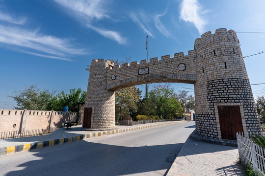 View of the historic stone archway of the Khyber Pass gate under a clear blue sky in Khyber District, Khyber Pakhtunkhwa, Pakistan.
