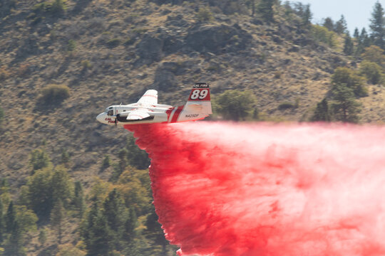 MILFORD CALIFORNIA SEPTEMBER 24, 2026 A CALFIRE S-2T airtanker drops retardant on the Grade Fire near Milford, California.