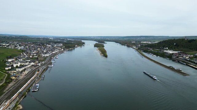 Aerial tracking shot of the Rhine River and R&uuml;desheim am Rhein town, Germany