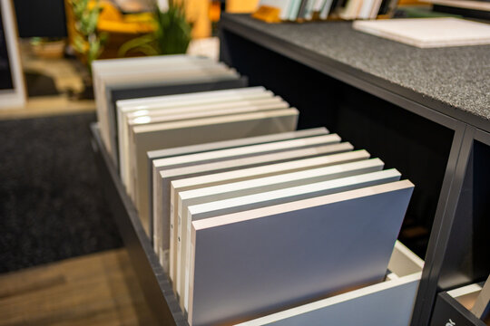 Wood finish samples in different shades displayed in furniture showroom. Material selection represents furniture design, renovation and interior planning