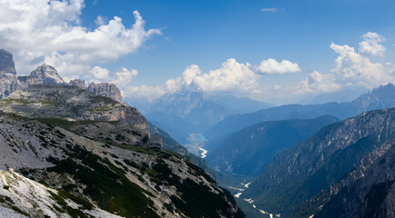 Obraz premium Mountain landscape panorama Tre Cime Mount against a blue summer background. 