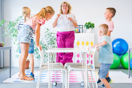 Kids having fun with therapist during occupational therapy activity.