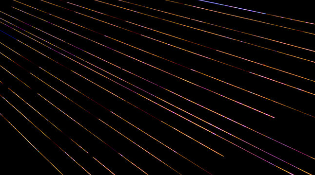 bright colorful light trails against a black background