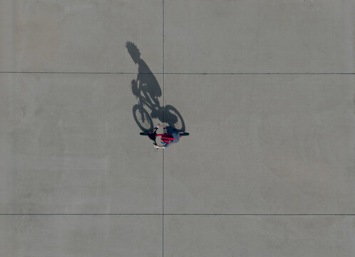 An Aerial Shot of a Boy Riding His Bicycle