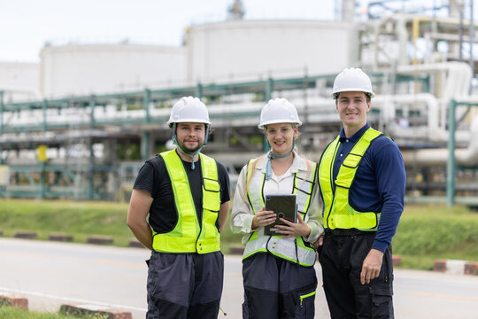 Engineers pose at oil refinery site