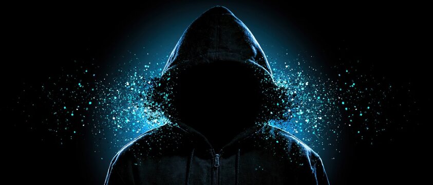 Hooded anonymous figure in a dark hoodie with blue digital particles on a black cyber background