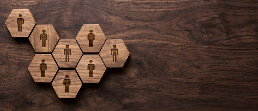 Human resources team concept with connected employee icons on wooden background