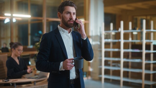 Authority Caucasian business man talking mobile phone with coffee cup businessman male entrepreneur employer talk virtual conversation communicate about work startup job project in corporate company