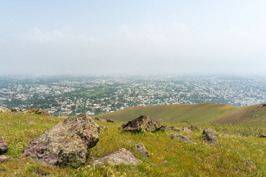 Hazy elevated view of Angren city in Spring, Uzbekistan