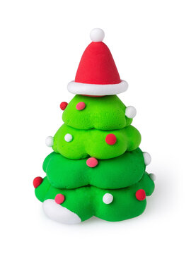 Christmas tree made of air dry plasticine clay with santa hat and ball ornaments isolated on white background, studio shot