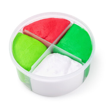 An open round container of air-drying self-hardening plasticine in four sections red, white, and green, isolated on a white background