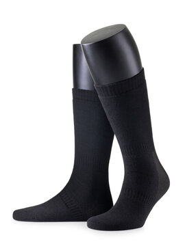Black knee high hunting socks on mannequin legs isolated on white background, product photography