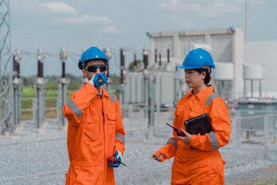 Electrical engineers are checking the operation and power distribution systems within the substation receiving power from the wind farm.	