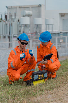 Electrical engineers are checking the operation and power distribution systems within the substation receiving power from the wind farm.	