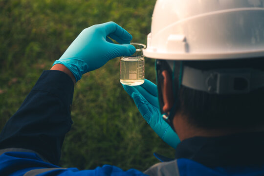 Environmental inspection team testing river water to monitor contamination.