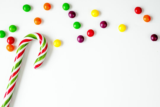 sweets and sugar candies on white background top view