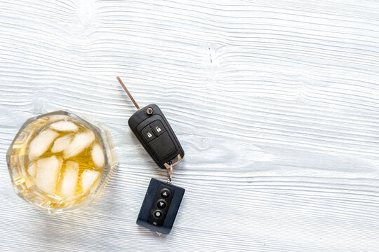 concept of alcohol and driving on wooden background top view