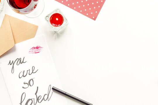 concept of Valentine Day love letter white background top view