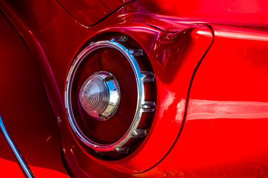 Beadlight of an old vintage red car