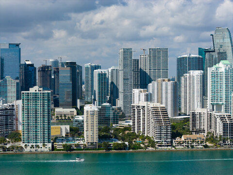 Miami skyline with coastal bay and shoreline. Miami aerial panorama with cityscape. Miami downtown skyline with towers. Miami seaside view with oceanfront.