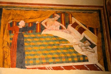 Obraz premium San Gimignano, Italy 03.04.2020: Memmo di Filippuccio - Profane love scenes- The spouses retired to bed