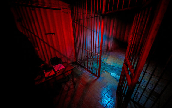 Open Metal Prison Gate with Red and Blue Cinematic Neon Lighting