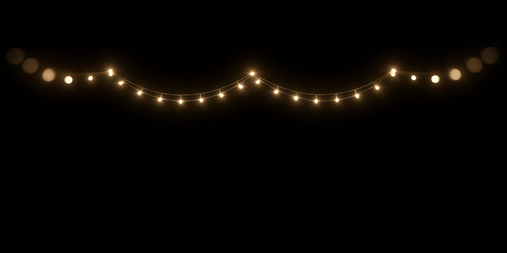 Glowing string lights hanging isolated on black background. Warm Glowing Bokeh. Festive warm fairy lights garland overlay. Christmas wedding party decoration 