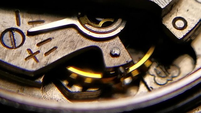 Macro Horizontal Shot of Watch Movement Regulator with Plus Minus Markings