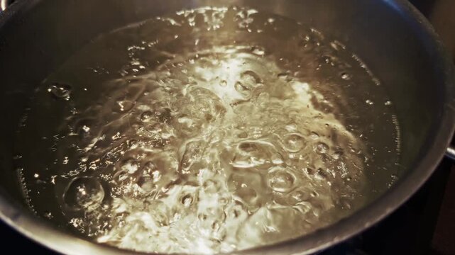 Spaghetti Pasta Plunged Into Boiling Water Inside Metal Pot. Preparation Italian Meal