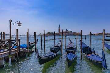 Gondolas docked at a wooden pier © Rui Vale de Sousa