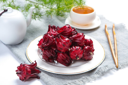 Fresh Roselle Hibiscus Flowers In Wooden Bowl For Herbal Tea
