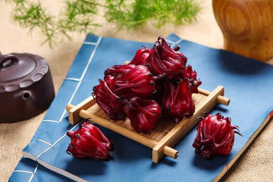 Fresh Roselle Hibiscus Flowers In Wooden Bowl For Herbal Tea