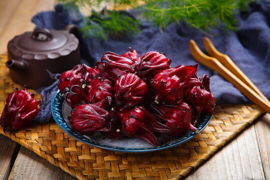 Fresh Roselle Hibiscus Flowers In Wooden Bowl For Herbal Tea