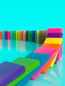 Vibrant colorful dominoes arranged in a curved line against a bright turquoise background