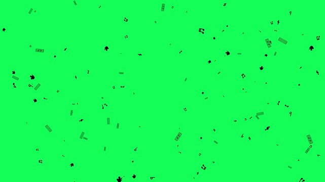 Black confetti particles falling on a green screen background