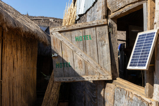 Wooden hotel door with solar panel, Tsiribihina, Madagascar