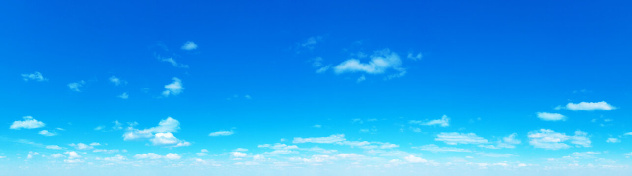 Blue Sky background with tiny Clouds. Panorama background