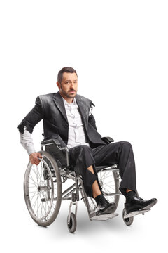Injured man sitting in a wheelchair with a serious expression