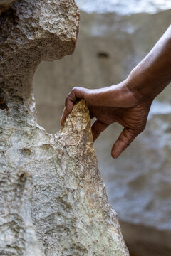 Hand touching a sharp limestone spike, Petit Tsingy, Madagascar