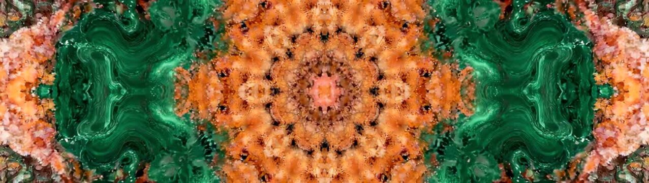 Malachite and jasper minerals creating a symmetrical pattern showing intricate geological structures and rich earthy tones.